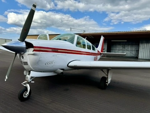 Front-quarter close-up of the Flying Country Club Beechcraft F33A Bonanza N4RB on the ramp
